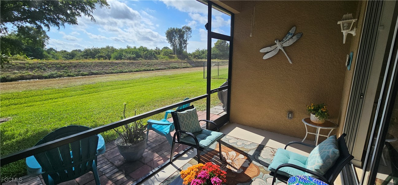 10788 Crossback Lane Lehigh Acres, FL 33936 - Photo 3 of 32 a view of a balcony with an ocean view