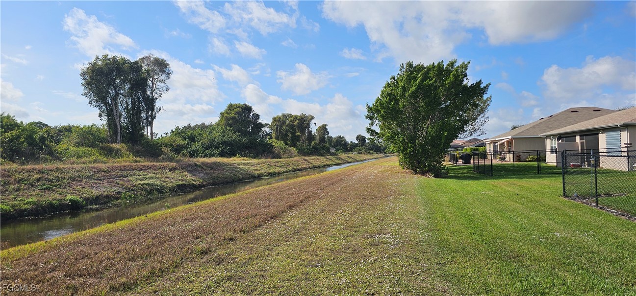 10788 Crossback Lane Lehigh Acres, FL 33936 - Photo 4 of 32 a view of house with yard and entertaining space