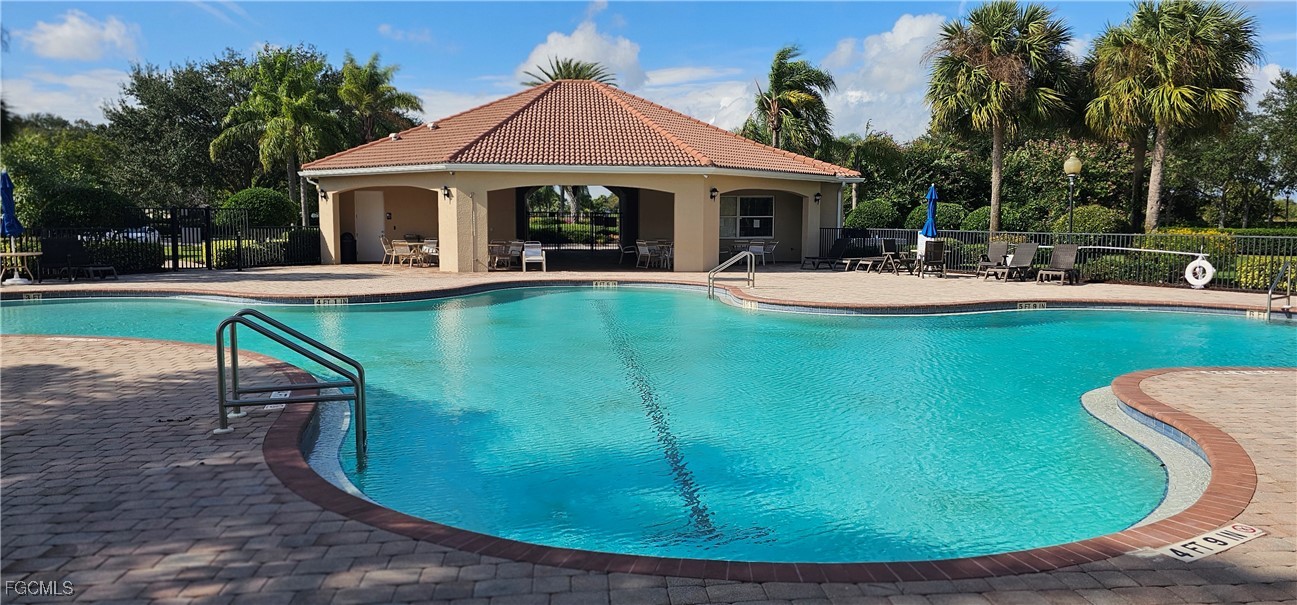 10788 Crossback Lane Lehigh Acres, FL 33936 - Photo 5 of 32 a view of a house with swimming pool and sitting area