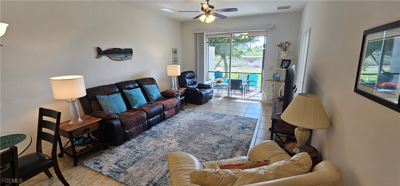 10788 Crossback Lane Lehigh Acres, FL 33936 - Photo 8 of 32 a living room with furniture and a window