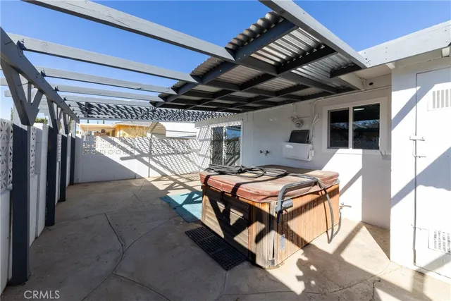 a patio with table and chairs