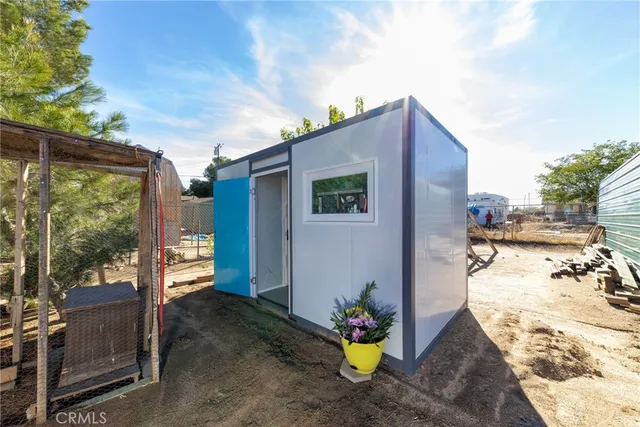 a view of hallway with cabinets and wooden floor