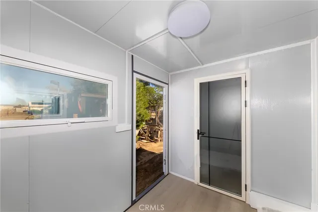 a bathroom with a granite countertop sink and shower