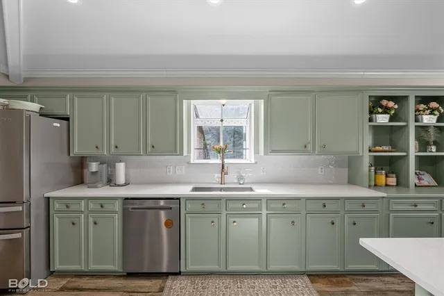 a kitchen with a sink cabinets and window