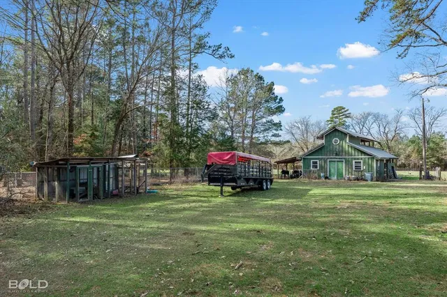 a view of a house with a back yard