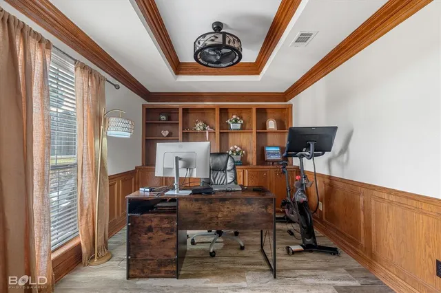 a view of a dining room with furniture and window