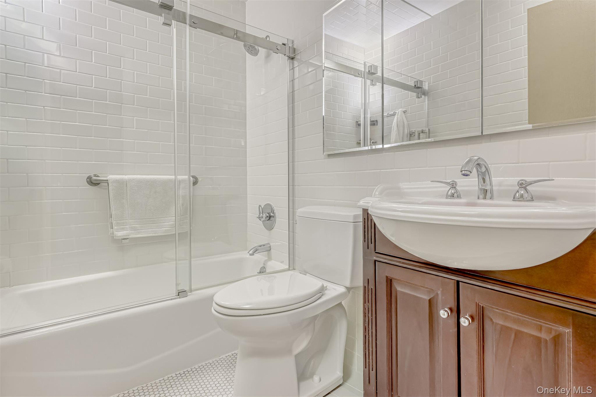 49 Camp Hill Road Pomona, NY 10970 - Photo 13 of 19 a bathroom with a sink toilet and shower