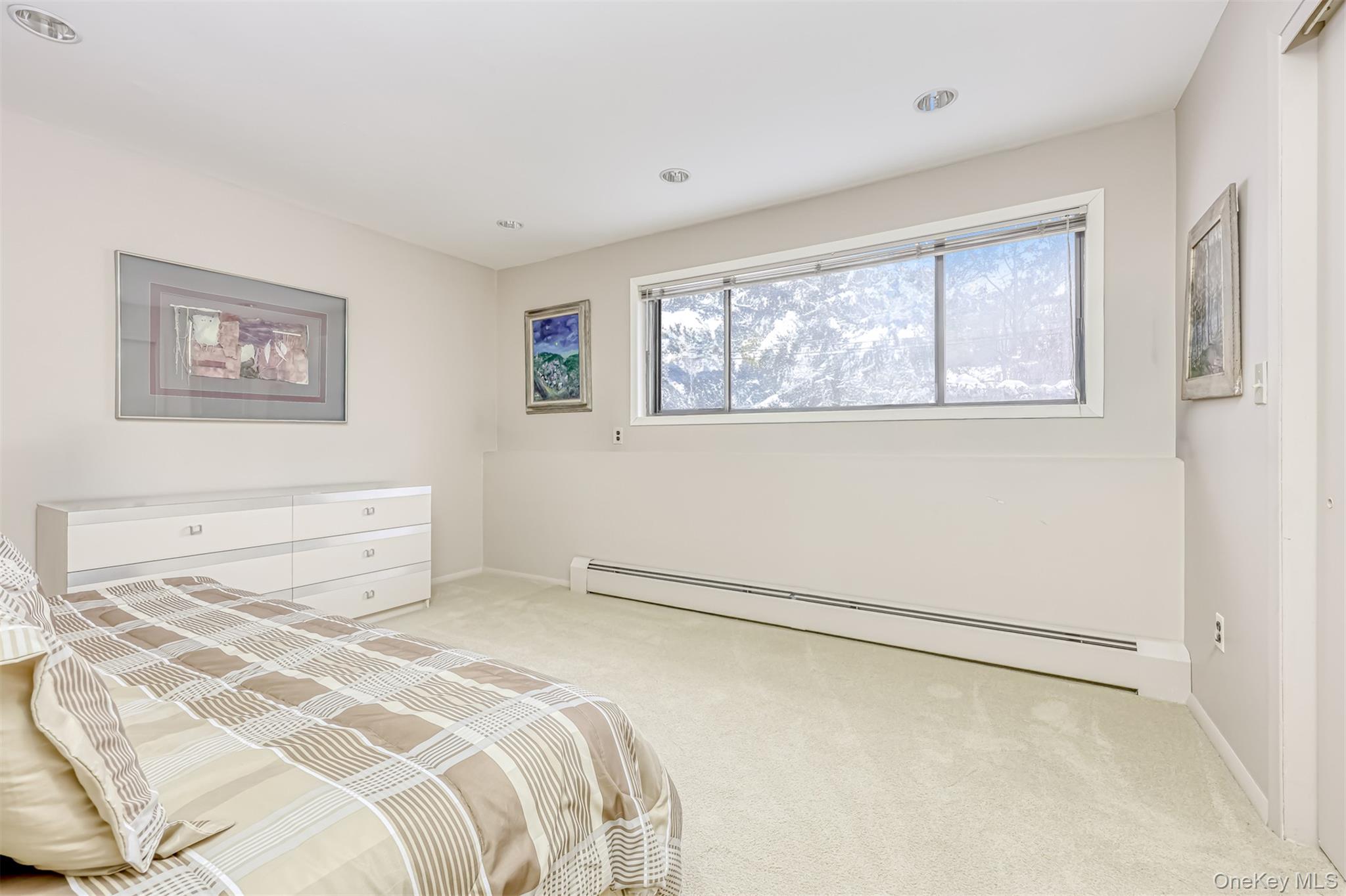 49 Camp Hill Road Pomona, NY 10970 - Photo 15 of 19 a bedroom with a bed and a window