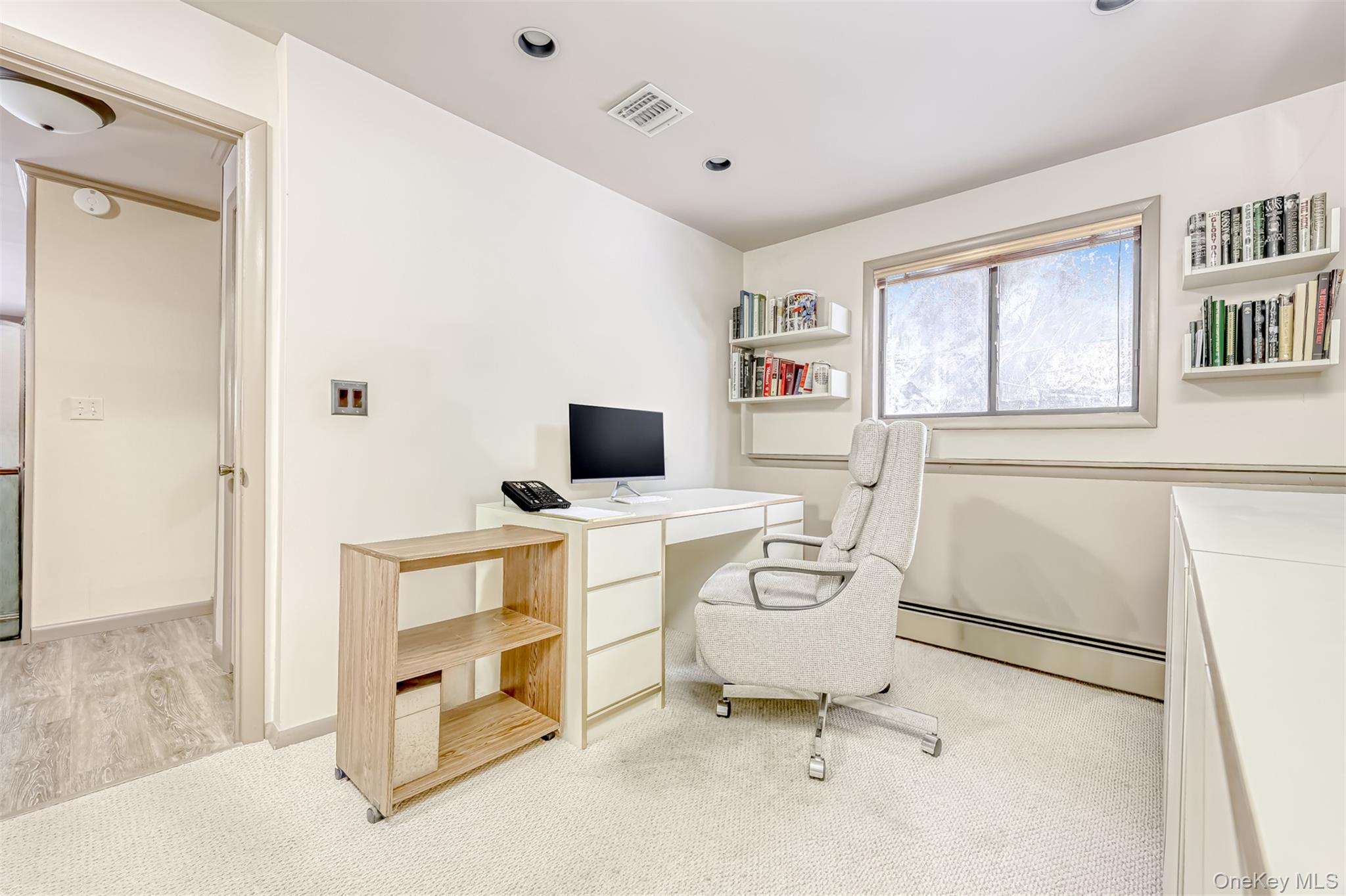 49 Camp Hill Road Pomona, NY 10970 - Photo 17 of 19 a view of a workspace with furniture and a window