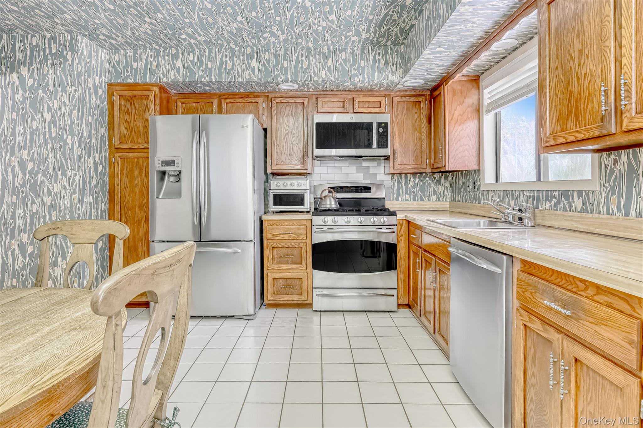 49 Camp Hill Road Pomona, NY 10970 - Photo 7 of 19 a kitchen with stainless steel appliances a refrigerator sink and microwave