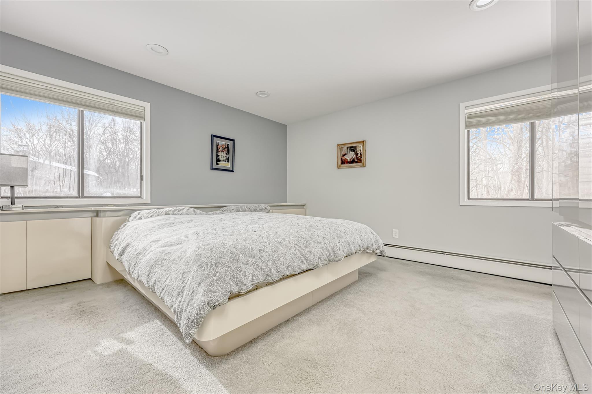 49 Camp Hill Road Pomona, NY 10970 - Photo 9 of 19 a large bed sitting in a bedroom next to a window