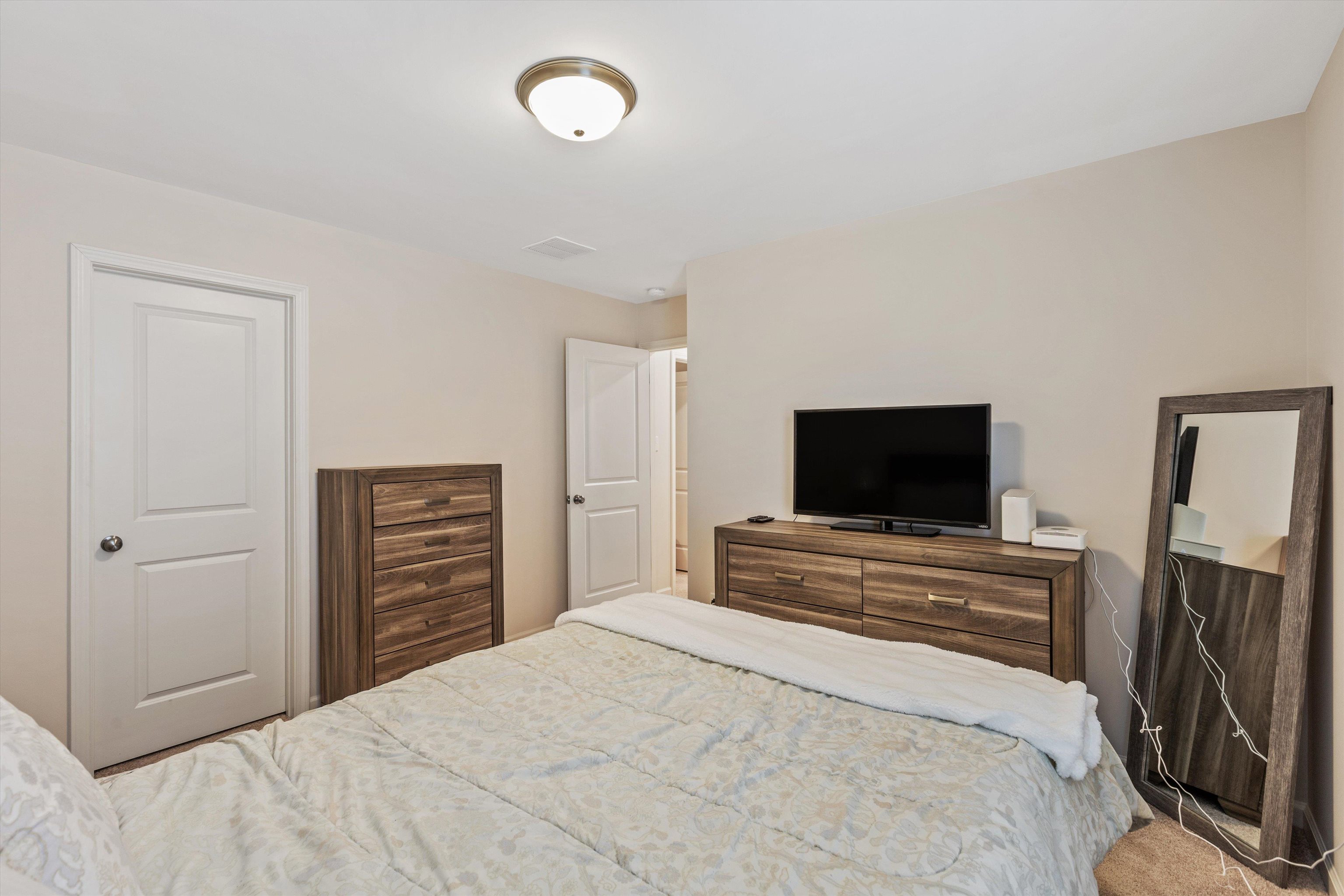 10139 Macon Road Cordova, TN 38018 - Photo 25 of 31 Neutral-toned walls complement the carpeted flooring