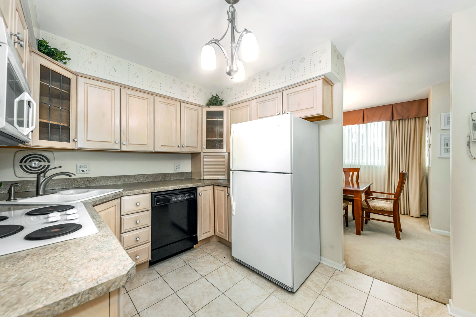 101 Bar Harbour Road, Unit 2G Schaumburg, IL 60193 - Photo 12 of 24 a kitchen with stainless steel appliances granite countertop a refrigerator a stove a sink and a refrigerator