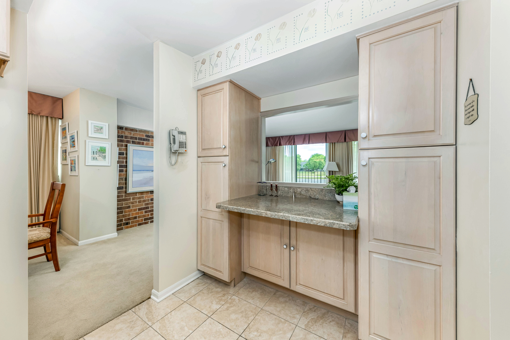 101 Bar Harbour Road, Unit 2G Schaumburg, IL 60193 - Photo 19 of 24 a kitchen with white cabinets and refrigerator