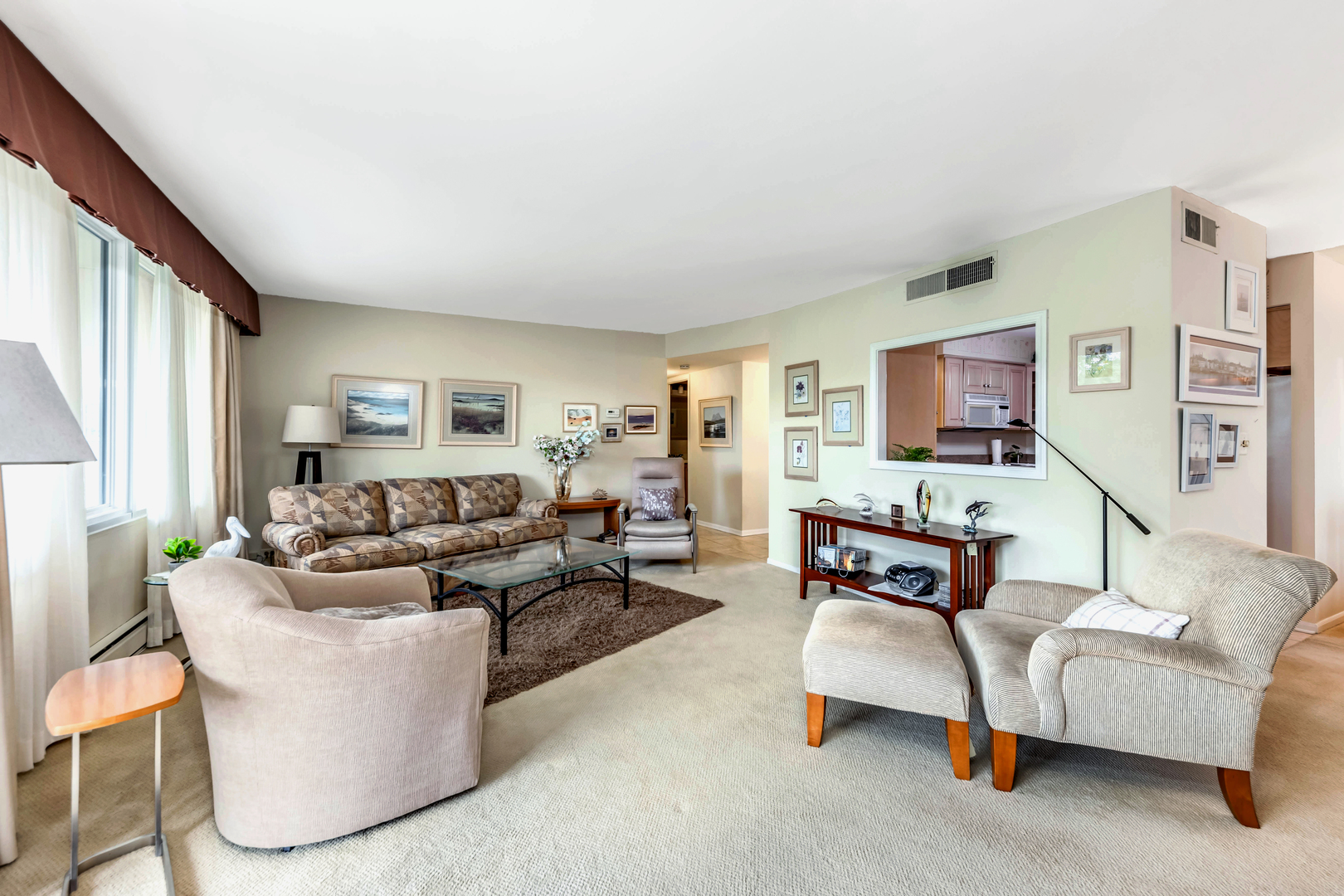 101 Bar Harbour Road, Unit 2G Schaumburg, IL 60193 - Photo 9 of 24 a living room with furniture and a flat screen tv