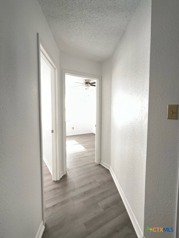 1815 Cedarhill Drive, Unit C Killeen, TX 76543 - Photo 14 of 27 a view of an empty room with wooden floor and a window