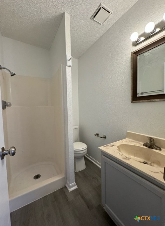 1815 Cedarhill Drive, Unit C Killeen, TX 76543 - Photo 18 of 27 a bathroom with a granite countertop sink a toilet and shower