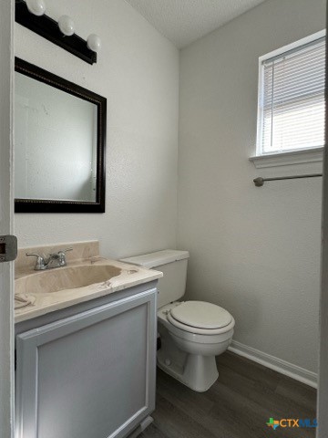1815 Cedarhill Drive, Unit C Killeen, TX 76543 - Photo 21 of 27 a bathroom with a toilet sink and mirror