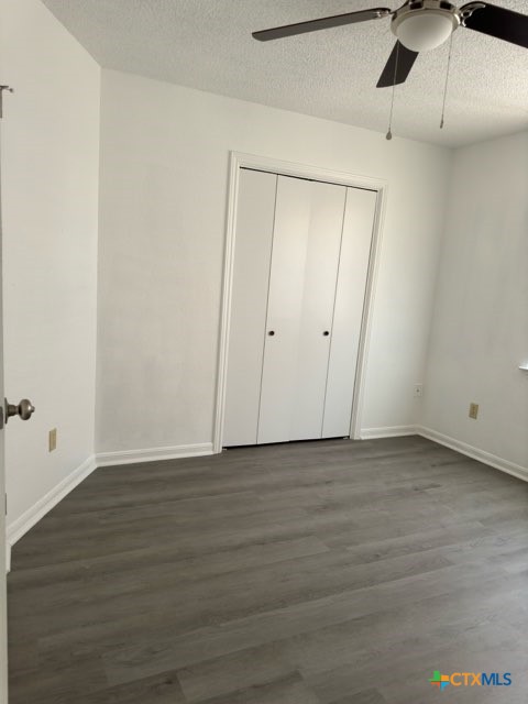 1815 Cedarhill Drive, Unit C Killeen, TX 76543 - Photo 23 of 27 a view of an empty room with wooden floor