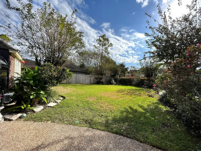 a view of a yard with swimming pool