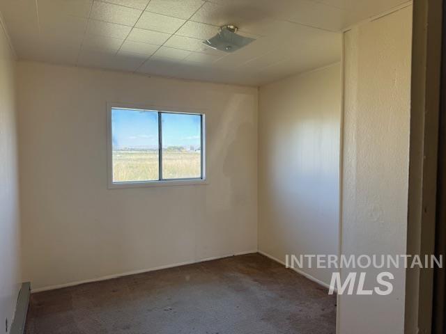 2900 West Sales Yard Road Emmett, ID 83617 - Photo 11 of 18 Empty room featuring carpet flooring