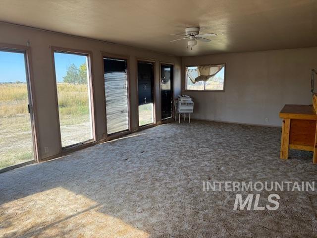 2900 West Sales Yard Road Emmett, ID 83617 - Photo 16 of 18 Unfurnished living room featuring carpet flooring and ceiling fan