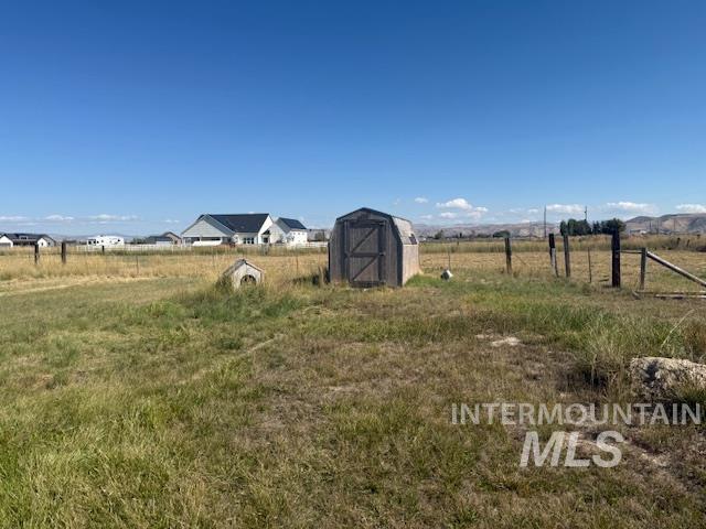 2900 West Sales Yard Road Emmett, ID 83617 - Photo 4 of 18 View of yard featuring a storage shed and a view of countryside