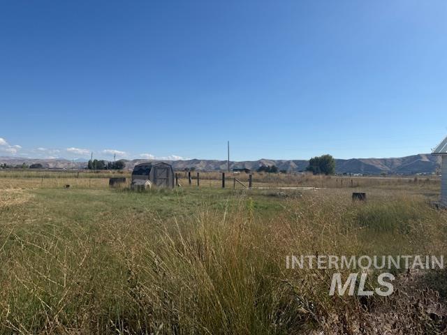 2900 West Sales Yard Road Emmett, ID 83617 - Photo 5 of 18 View of yard featuring a rural view and a mountain view