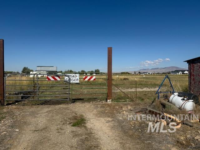 2900 West Sales Yard Road Emmett, ID 83617 - Photo 9 of 18 View of yard with a view of countryside and a gate