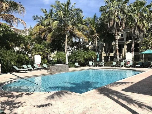 a view of a yard with palm trees