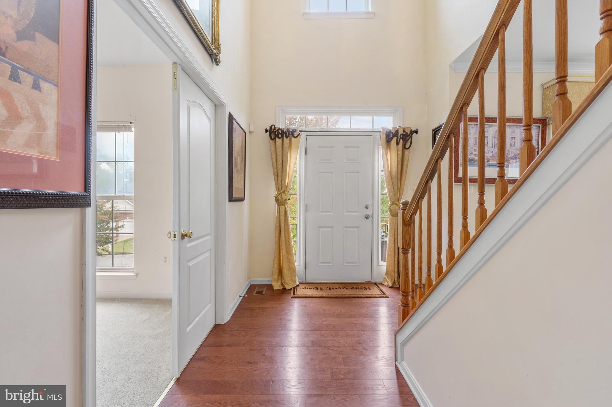 10107 Mike Road Fort Washington, MD 20744 - Photo 12 of 35 a view of a hallway with wooden floor and staircase