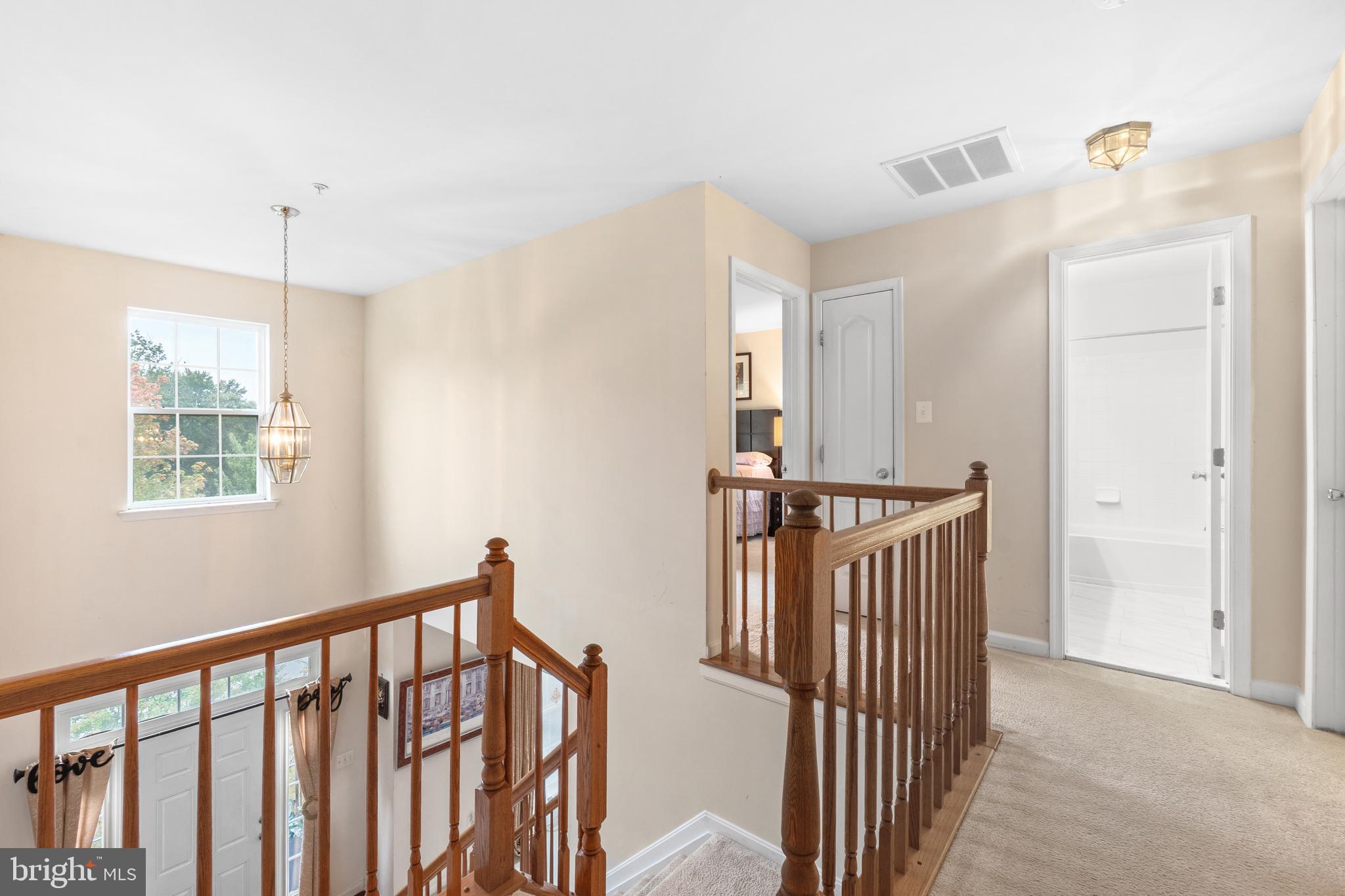 10107 Mike Road Fort Washington, MD 20744 - Photo 13 of 35 a view of a hallway with windows