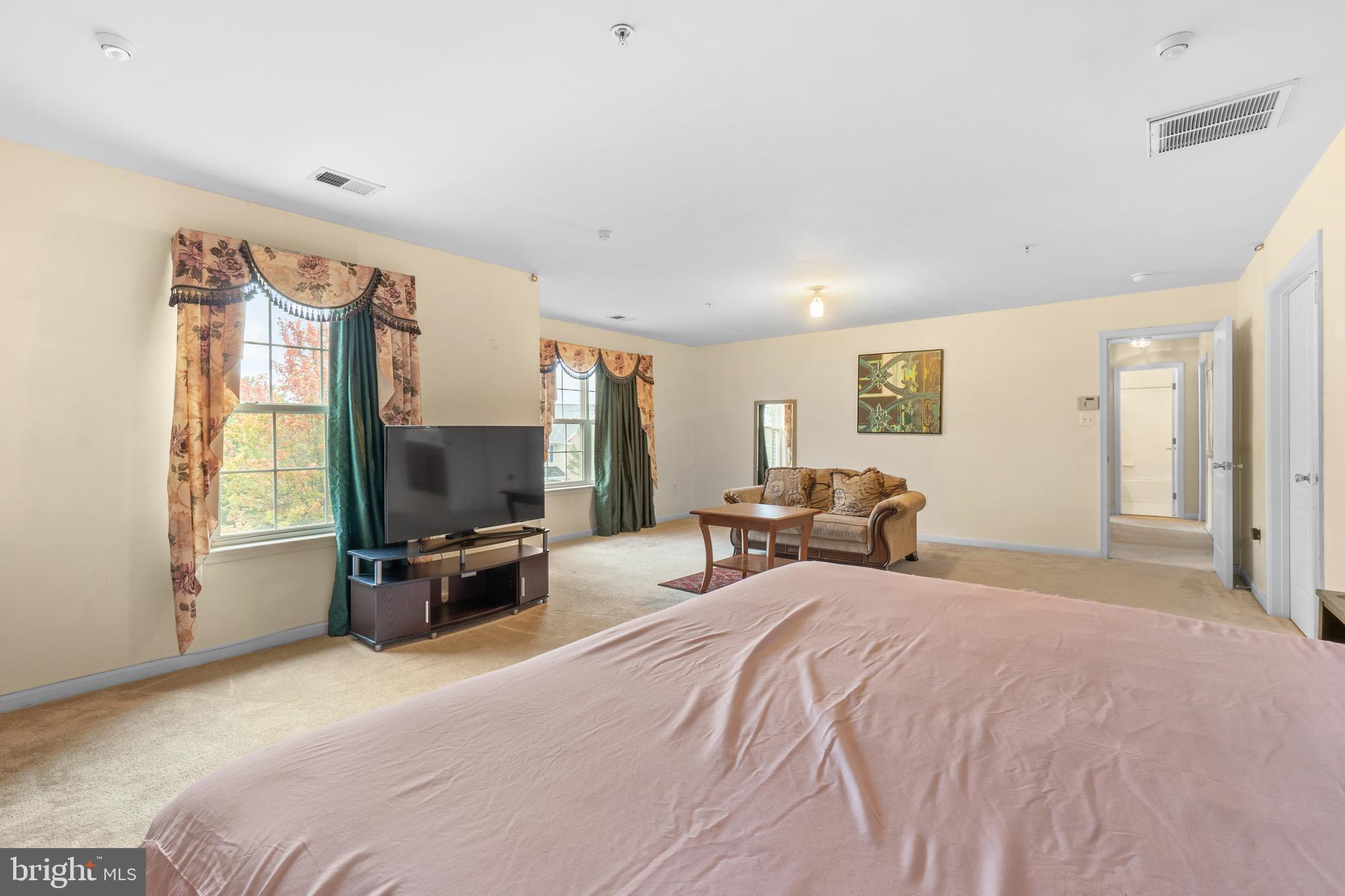 10107 Mike Road Fort Washington, MD 20744 - Photo 17 of 35 a bedroom with bed tv and window