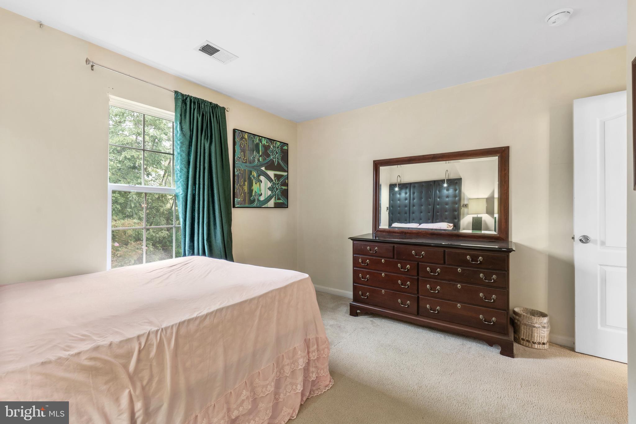 10107 Mike Road Fort Washington, MD 20744 - Photo 28 of 35 a bedroom with a bed and a dresser
