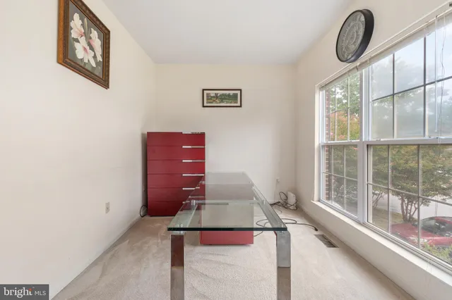 a view of a livingroom with furniture and windows