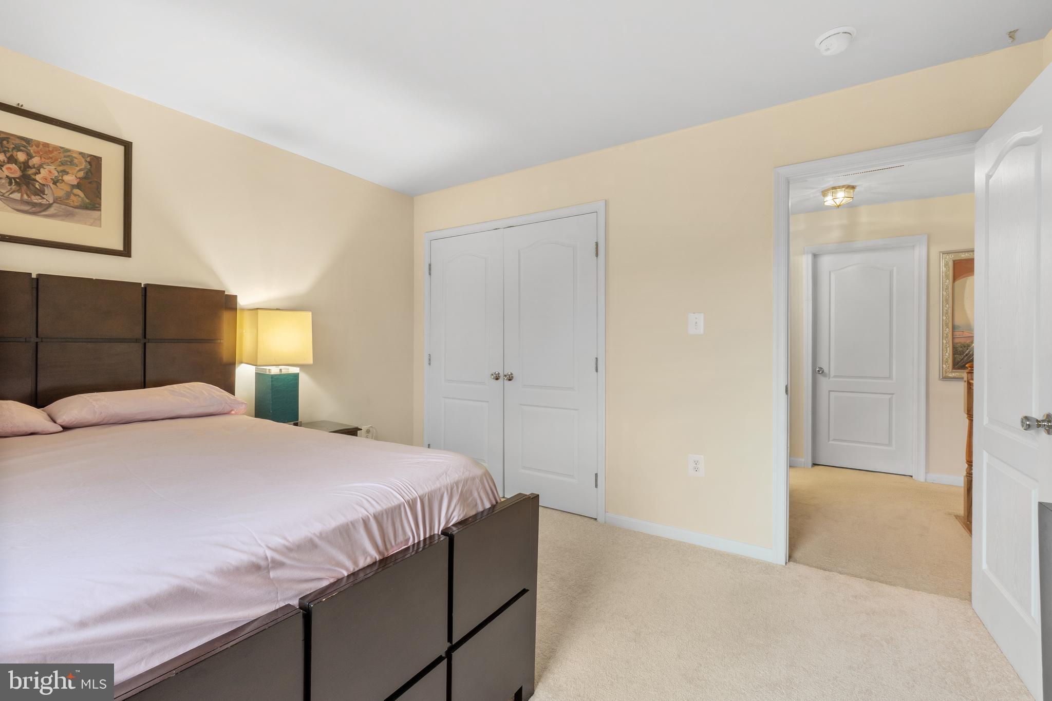 10107 Mike Road Fort Washington, MD 20744 - Photo 32 of 35 a bedroom with a bed and a painting on the wall