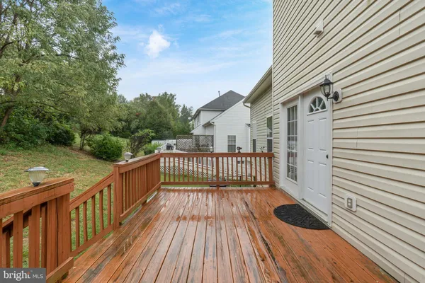 a view of a balcony with wooden floor