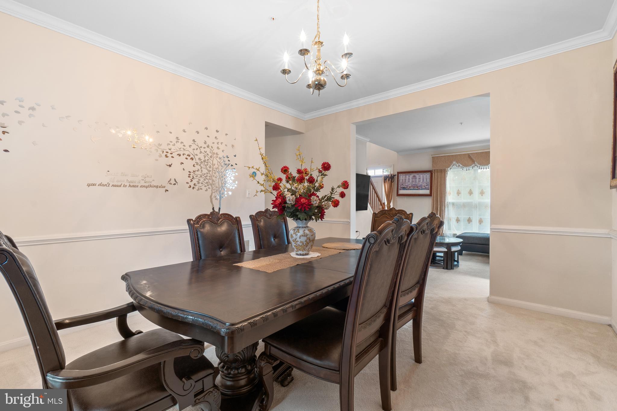 10107 Mike Road Fort Washington, MD 20744 - Photo 5 of 35 a view of a dining room with furniture and a chandelier