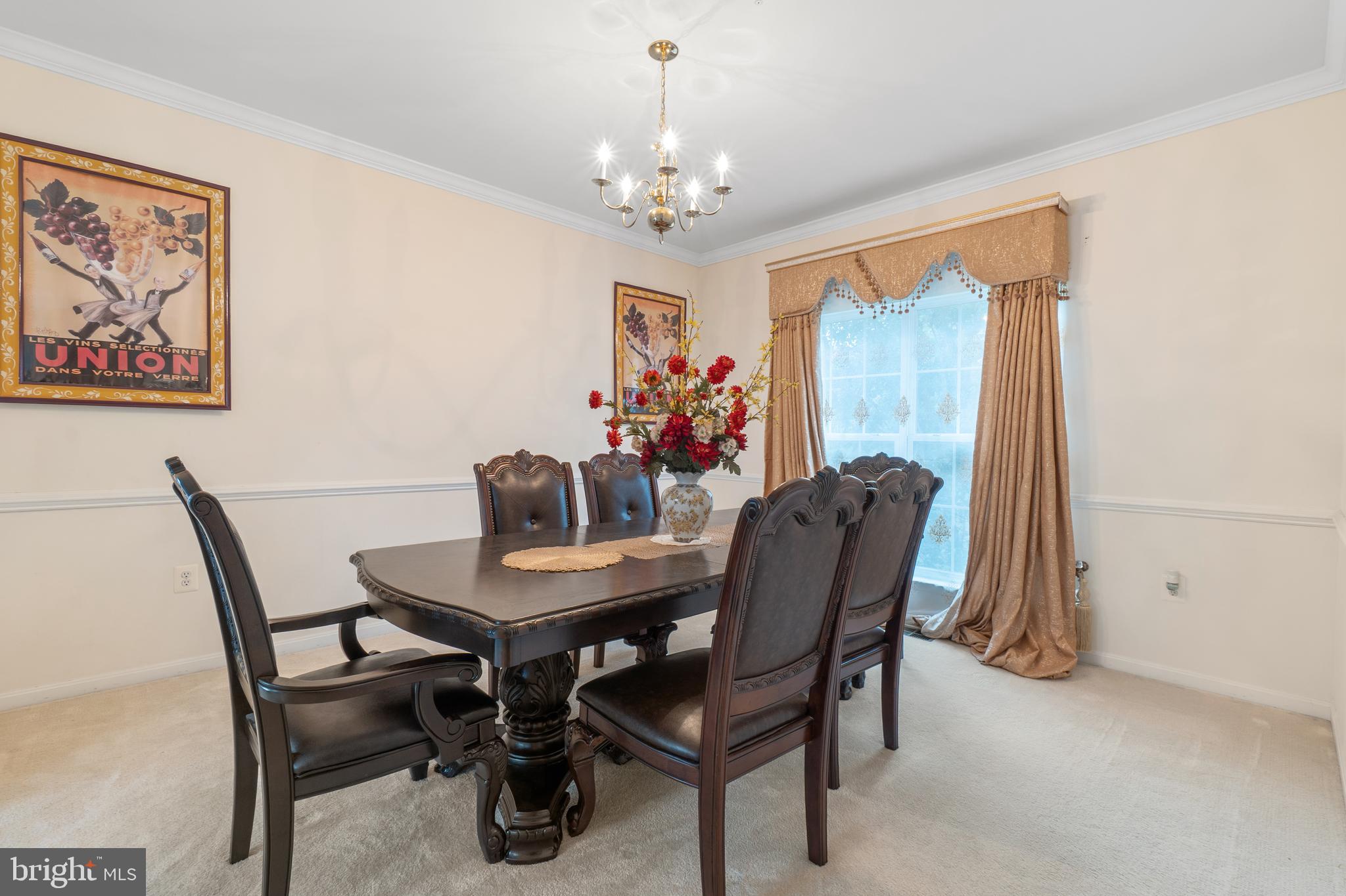 10107 Mike Road Fort Washington, MD 20744 - Photo 6 of 35 a view of a dining room with furniture and chandelier