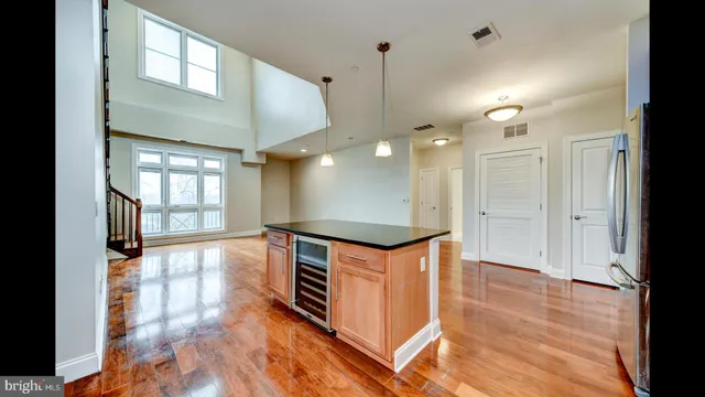 a kitchen with stainless steel appliances granite countertop a stove and a refrigerator