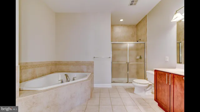 a bathroom with a bathtub and a toilet