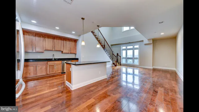a view of kitchen with cabinets and wooden floor