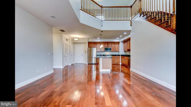 a view of kitchen with cabinets and wooden floor