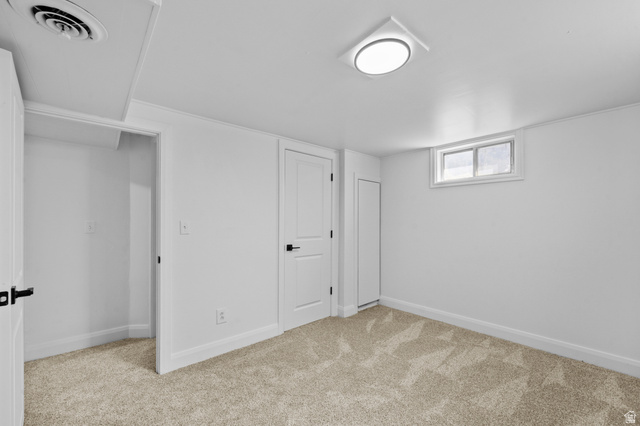2267 West 4350th Street South Roy, UT 84067 - Photo 29 of 32 Basement with baseboards and light carpet
