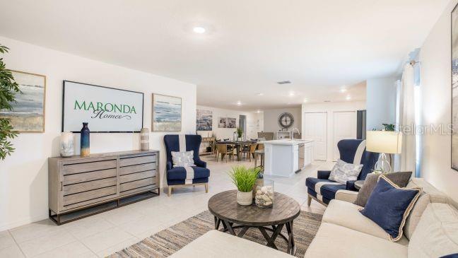 16290 Kakawi Road Weeki Wachee, FL 34614 - Photo 6 of 22 a living room with furniture and a table