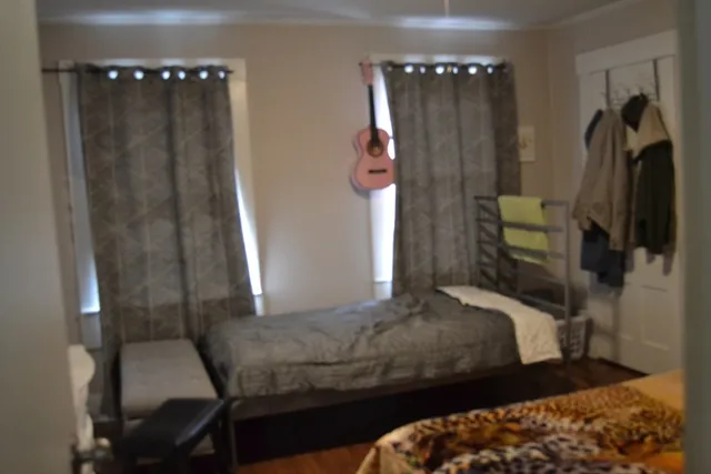 a bedroom with a bed and a table