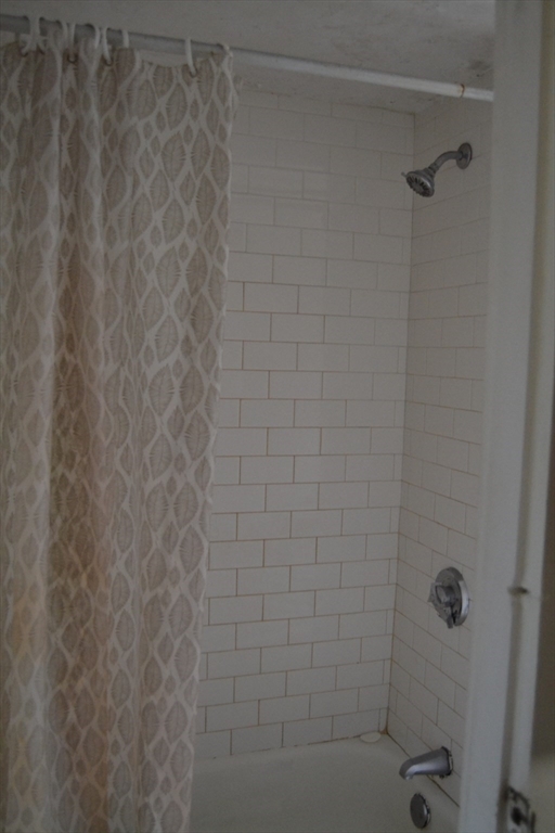 32 Wamesit Street, Unit 3 Lowell, MA 01852 - Photo 13 of 14 a bathroom with a shower