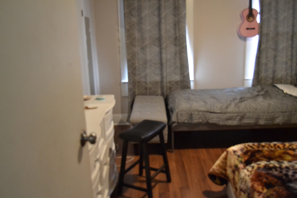 32 Wamesit Street, Unit 3 Lowell, MA 01852 - Photo 2 of 14 a bathroom with a sink and a mirror