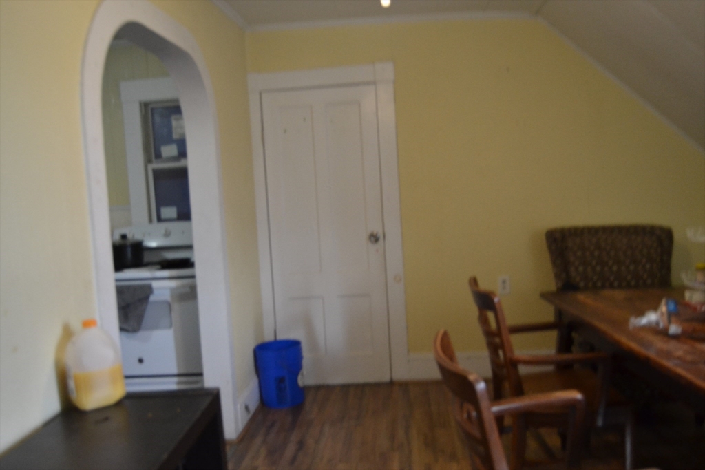 32 Wamesit Street, Unit 3 Lowell, MA 01852 - Photo 9 of 14 a view of workspace filled with furniture and wooden floor