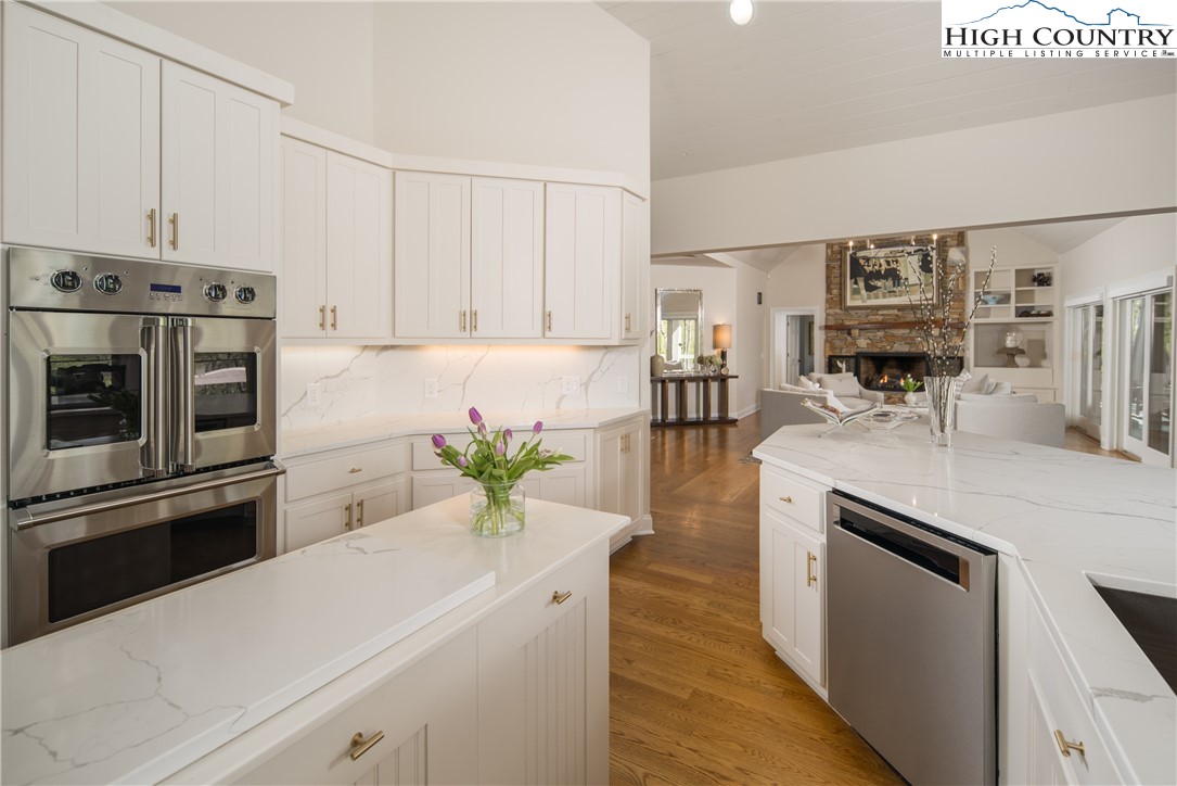 1005 Evergreen Drive Boone, NC 28607 - Photo 11 of 44 a kitchen with stainless steel appliances white cabinets a sink and a stove